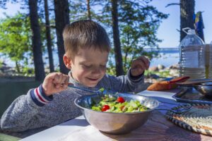 youth pitching player eating nutritious salad