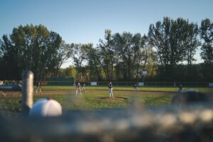 youth pitching player in a game