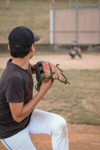 high schooler pitching during pitching instruction to improve timing