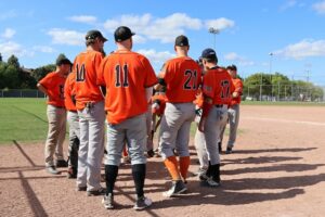 Athletes receiving pitching instruction on proper warm ups.