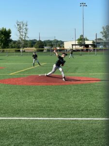 Youth pitching athlete during a game